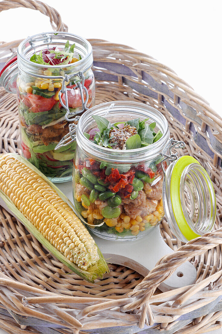 Vegetable salad with meat in jars