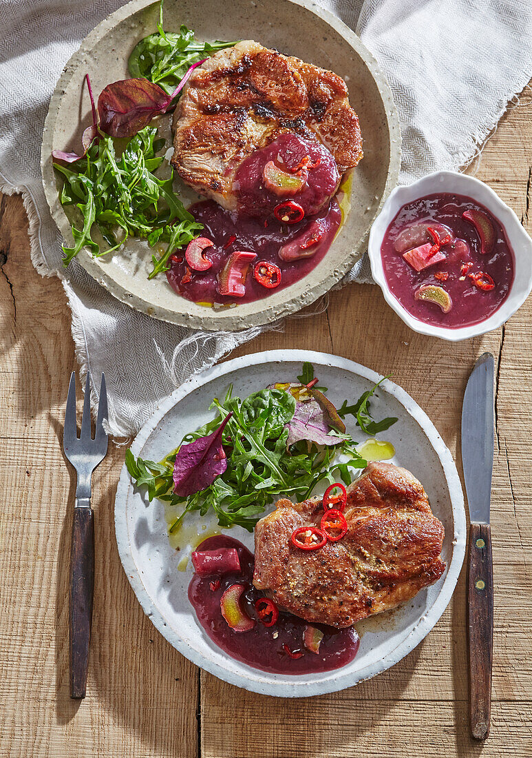 Spicy rhubarb sauce with chili over meat