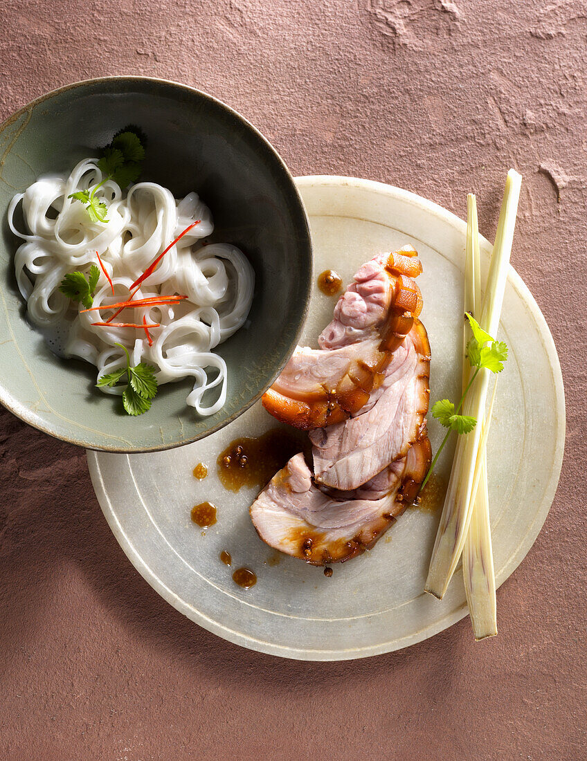 Asian suckling pig shank with rice noodles