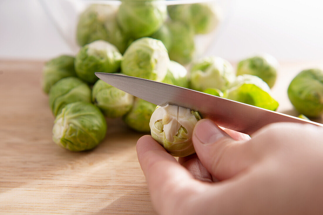 Cutting a cross into Brussels sprouts 