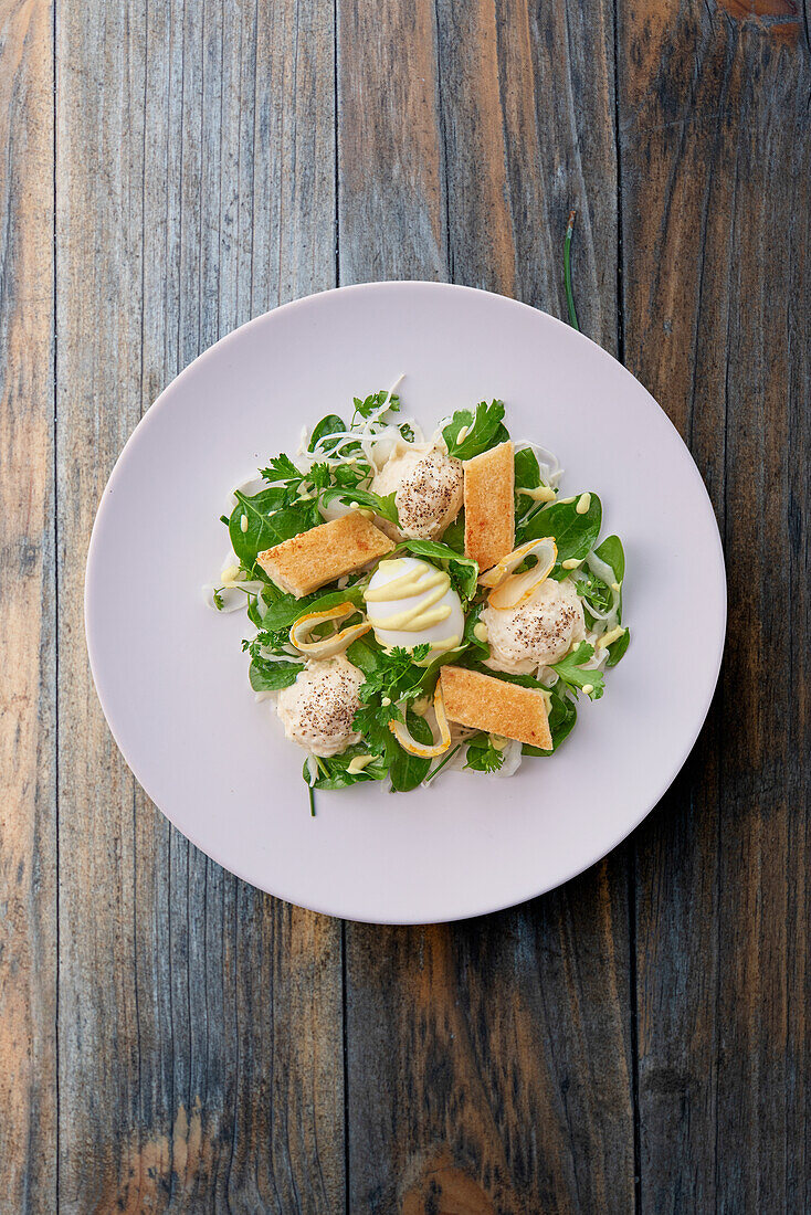 Fried haddock with quail egg, lemongrass and spinach