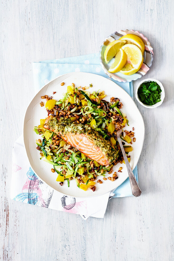 Lemon crusted salmon on vegetables and grains