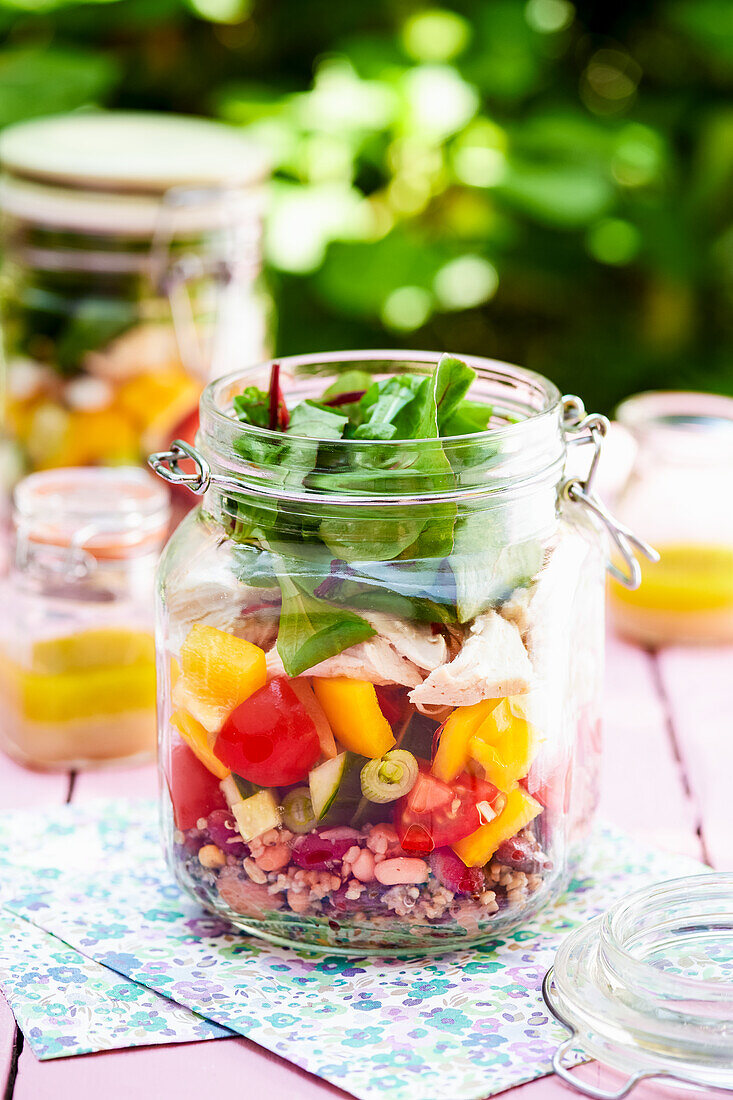 Picnic jars with vegetable granola salad and tuna