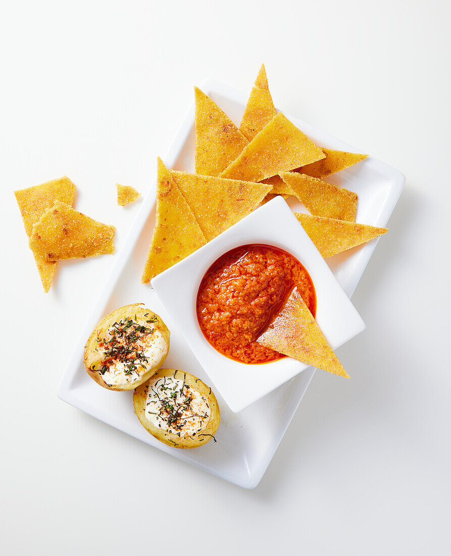 Baked potatoes with spice topping and tortilla chips