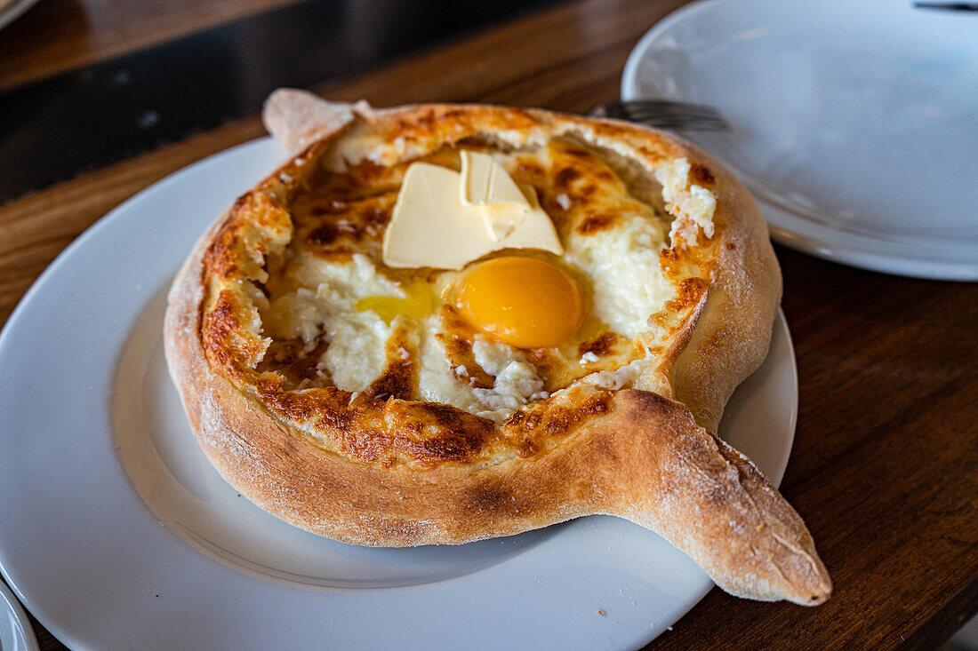 Adjarian Khachapuri (Georgian bread with cheese filling and raw egg)