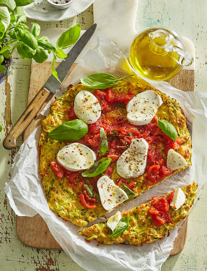 Zucchini pizza crust with tomatoes and mozzarella