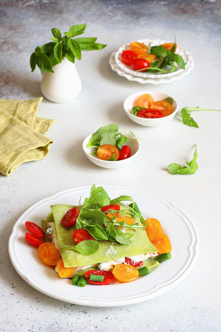 Rucola-Lasagne mit Ricotta, grünen Bohnen und Tomaten