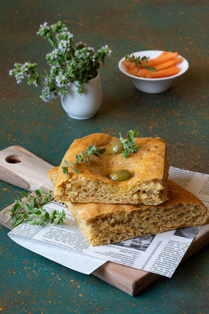 Focaccia with carrots, oregano, rosemary, and olives