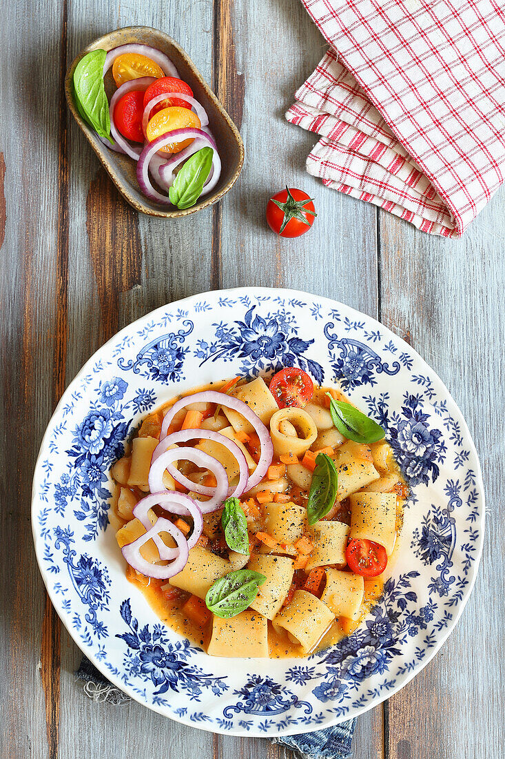 Summer noodle soup with cannelloni beans and cherry tomatoes