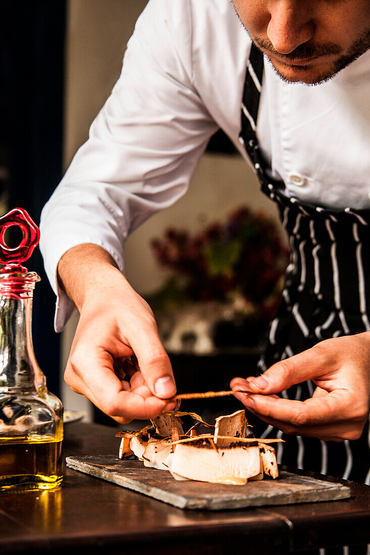 Chef serves mushrooms