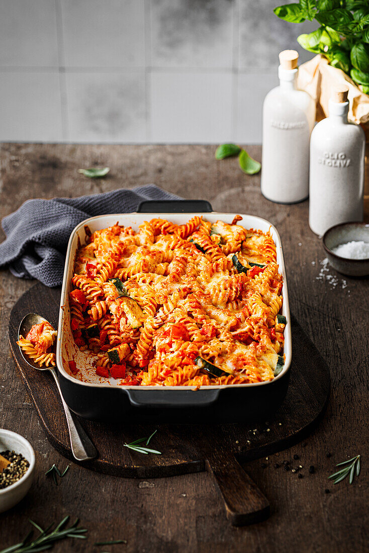 Pasta bake with tomato sauce, zucchini, red peppers and carrots