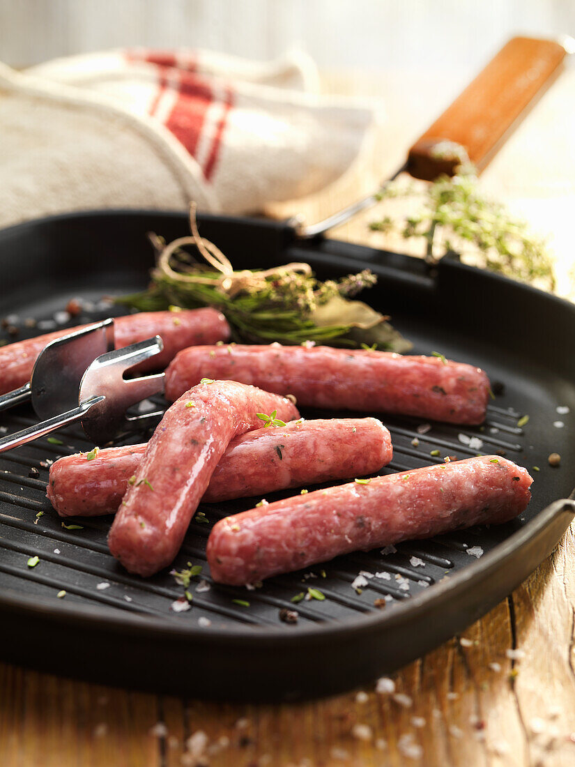 Pork sausage without skin on a grill pan