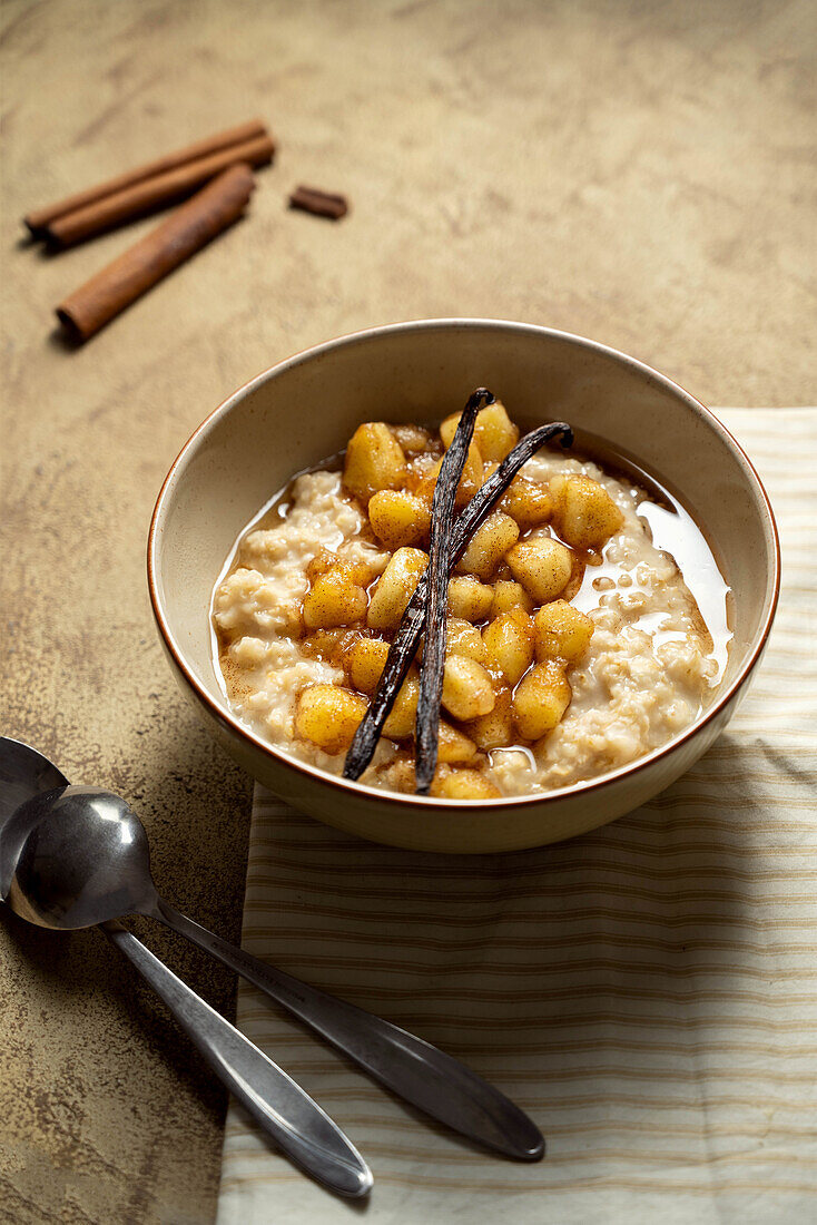 Oatmeal breakfast with cinnamon, caramel apples, and vanilla