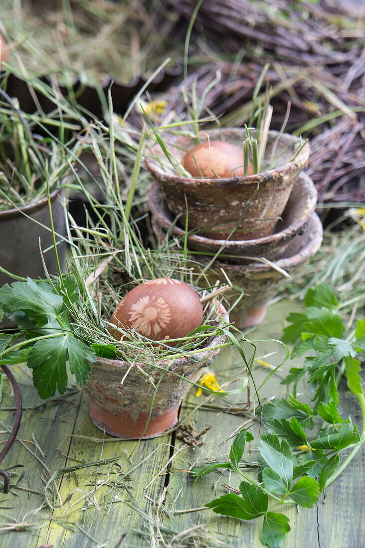 Easter eggs dyed in onion skins with flower decoration