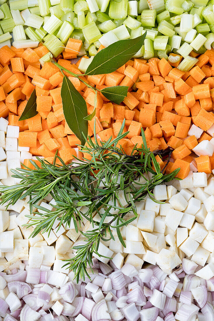 Vegetable cubes (celery, carrots, celeriac, onion) with bay leaf and rosemary