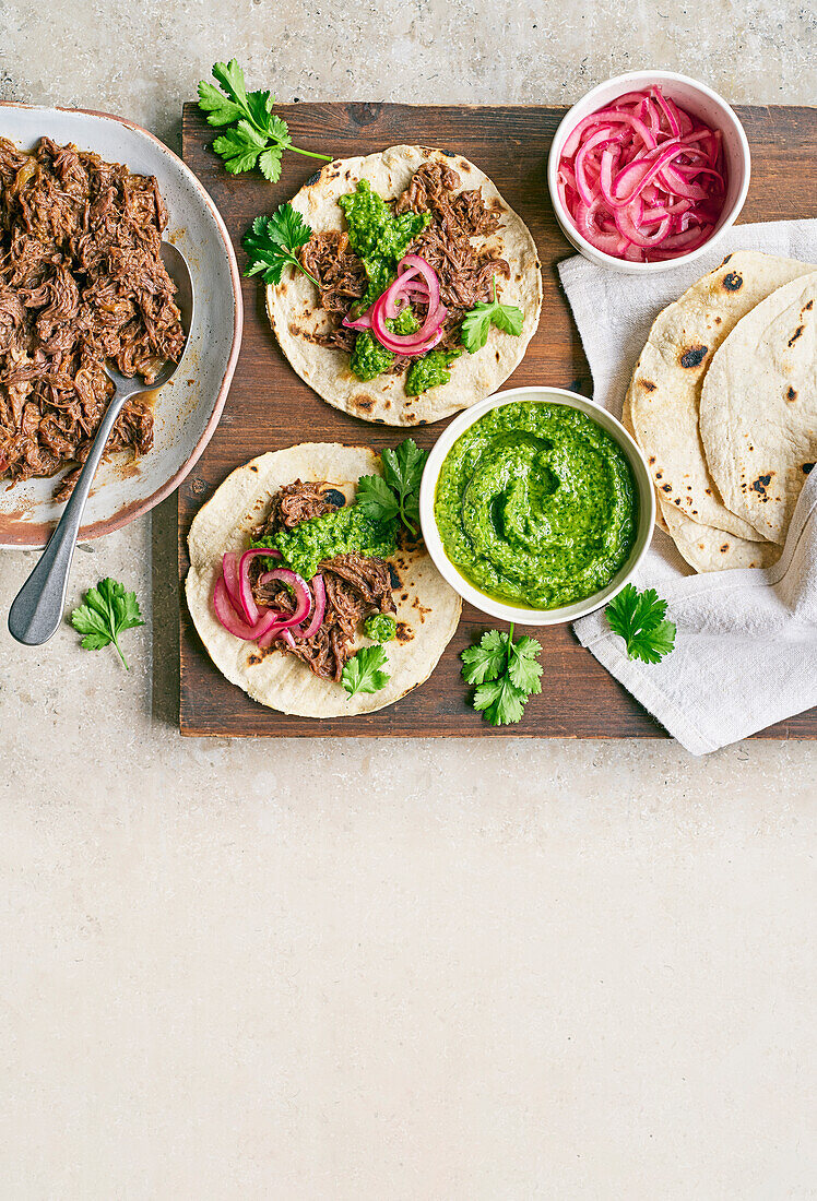 Beef cheek tacos with green chili salsa