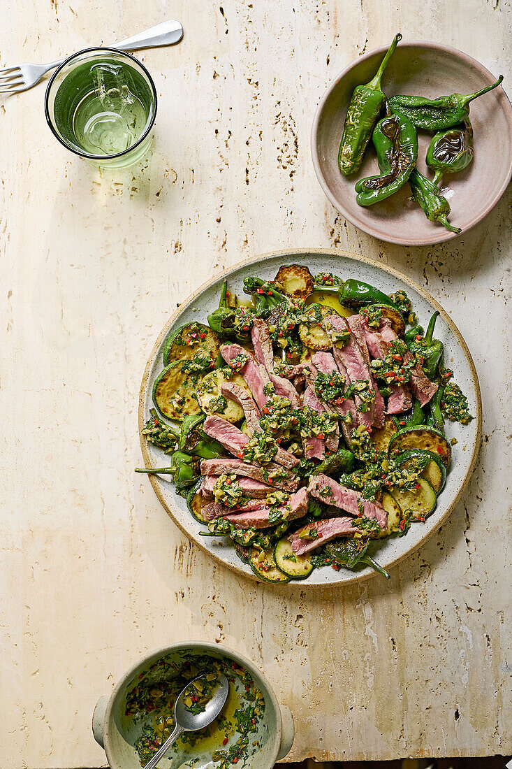 Olive chimichurri steak with Padron peppers