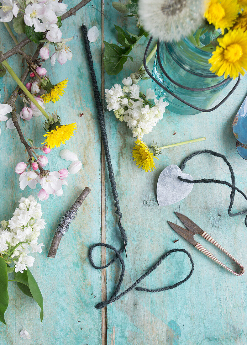 Apple blossoms, lilac and dandelion, hearts made of tin and string