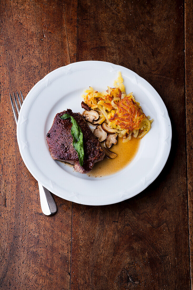 Beef steak with rösti and mushrooms