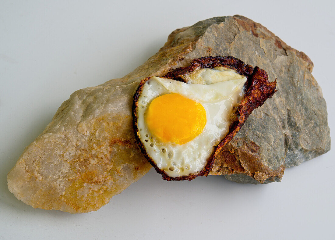 Fried egg on a hot stone
