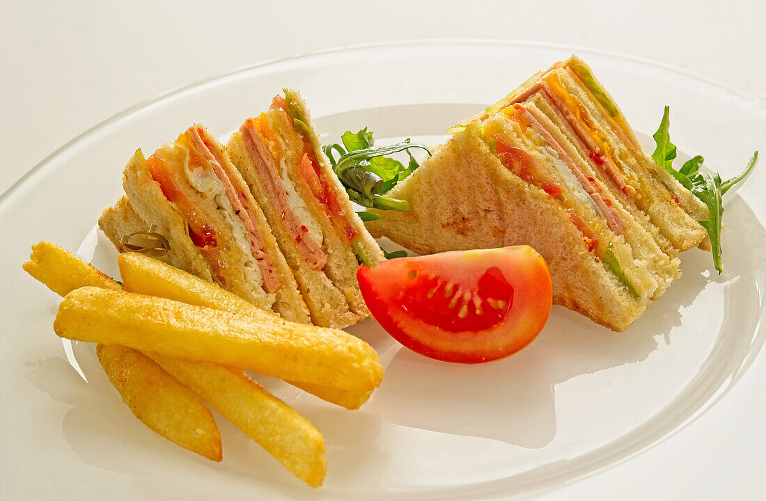 Club sandwiches with fries