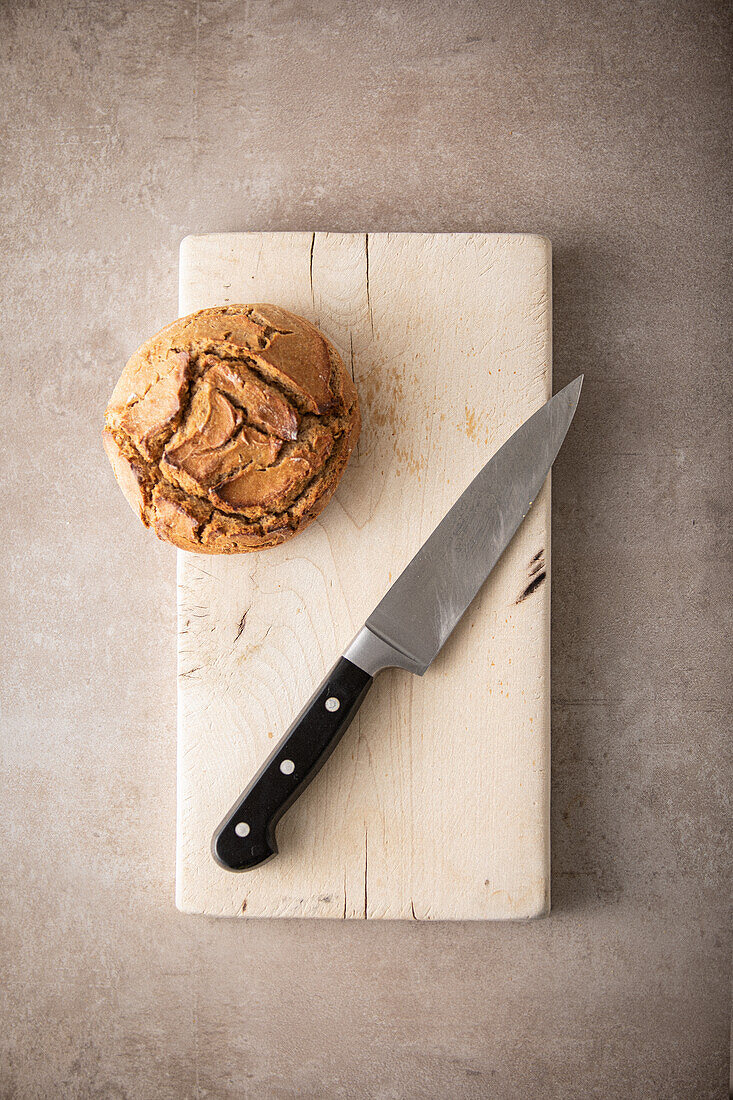 Bread and knife on a wooden board