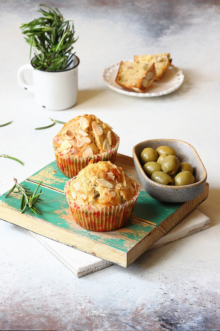 Cheese muffins with Emmental cheese and almonds served with green olives