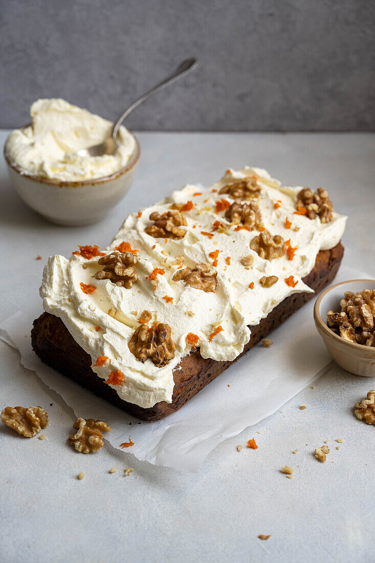 Carrot pound cake with wallnuts and cheese frosting