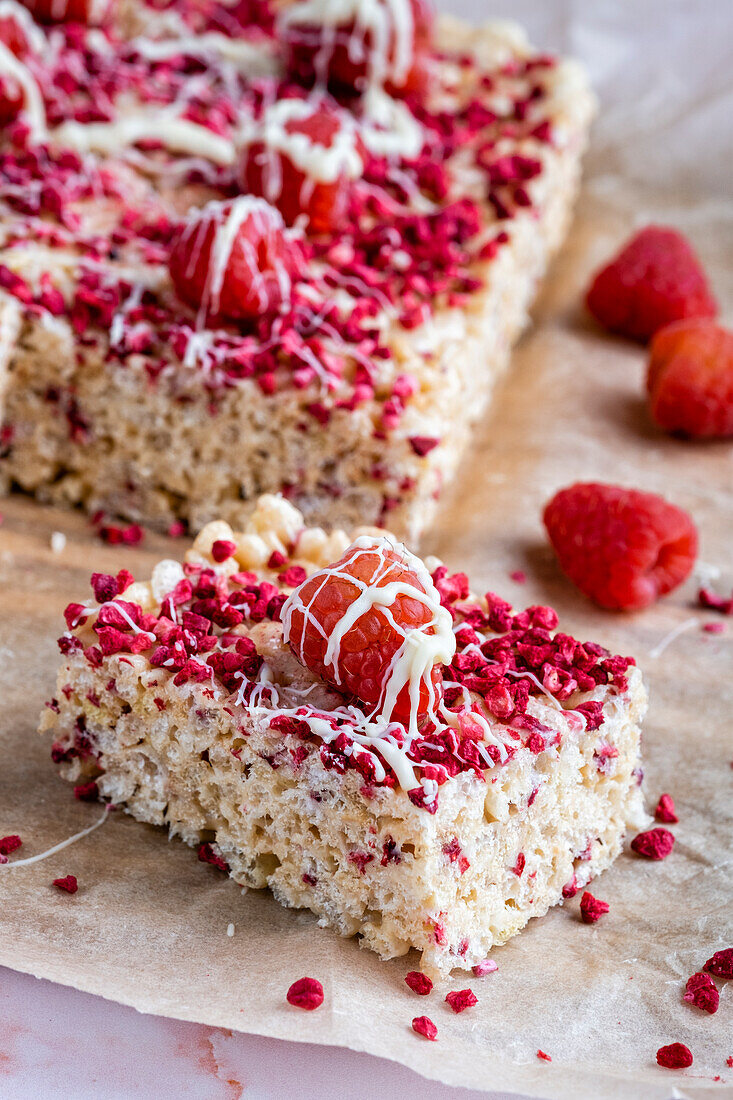 Rice krispie treat with white chocolate and raspberries