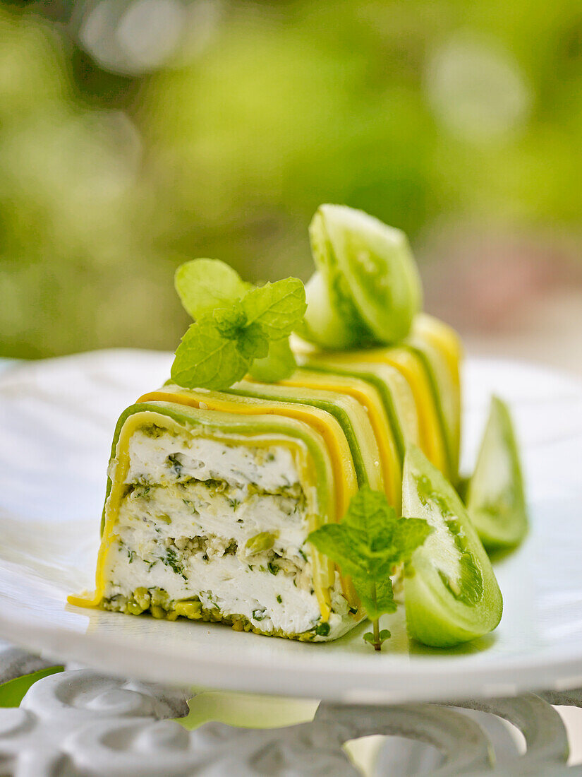 Goat cheese terrine with zucchini and pistachios