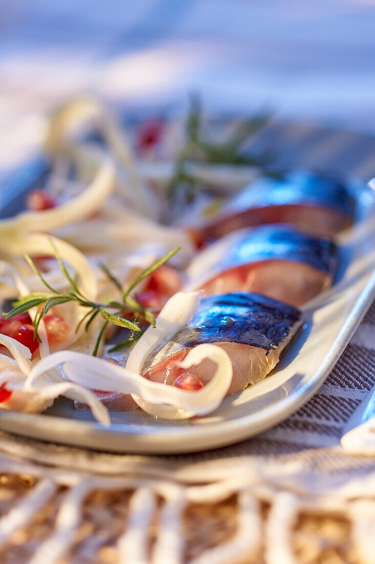 Marinated mackerel fillet with lemon and fennel salad and pomegranate vinaigrette