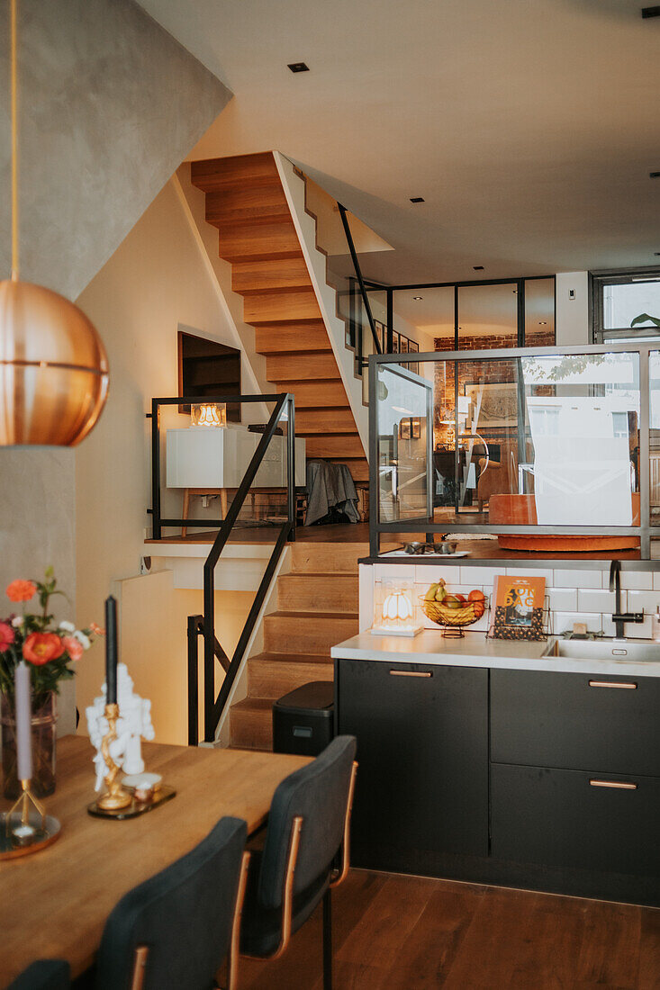 Kitchen and dining area with wooden staircase