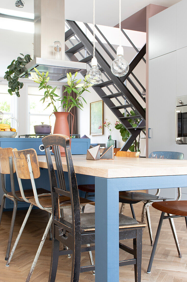 Dining area with industrial-style wooden furniture and chairs