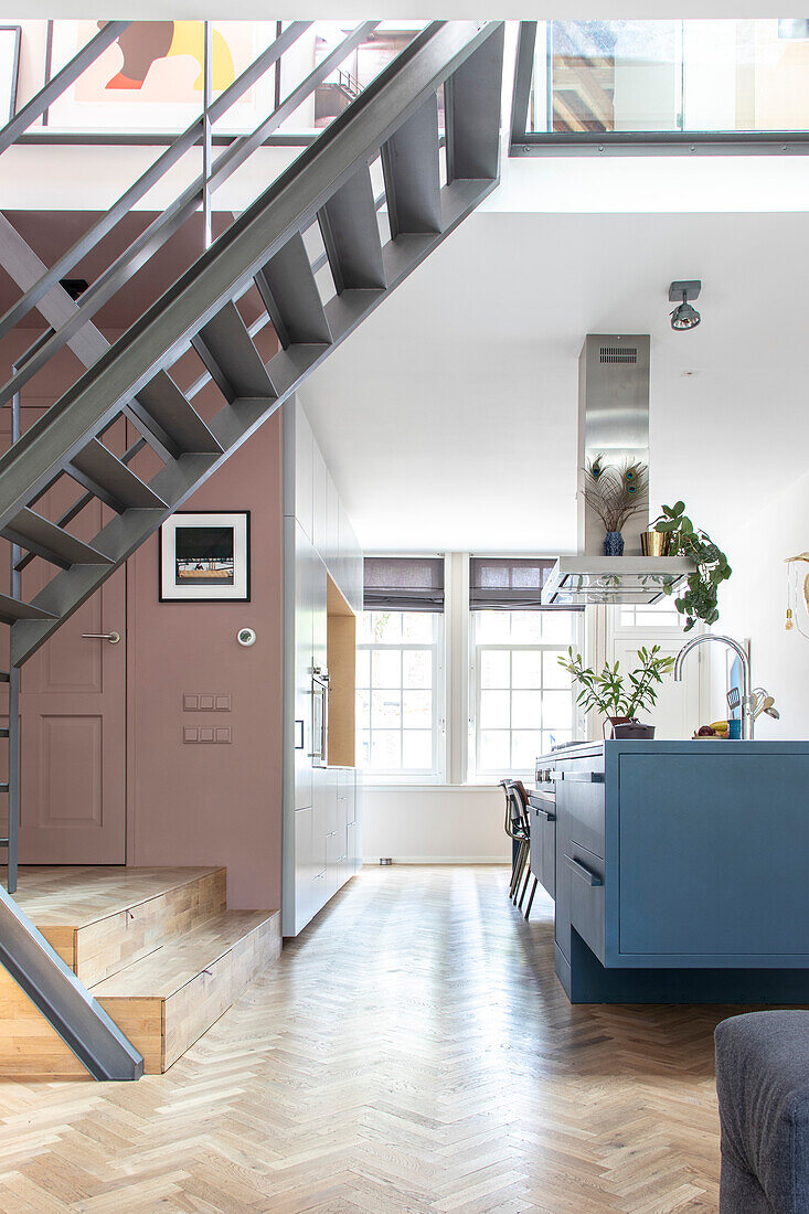 Modern loft kitchen with blue kitchen island