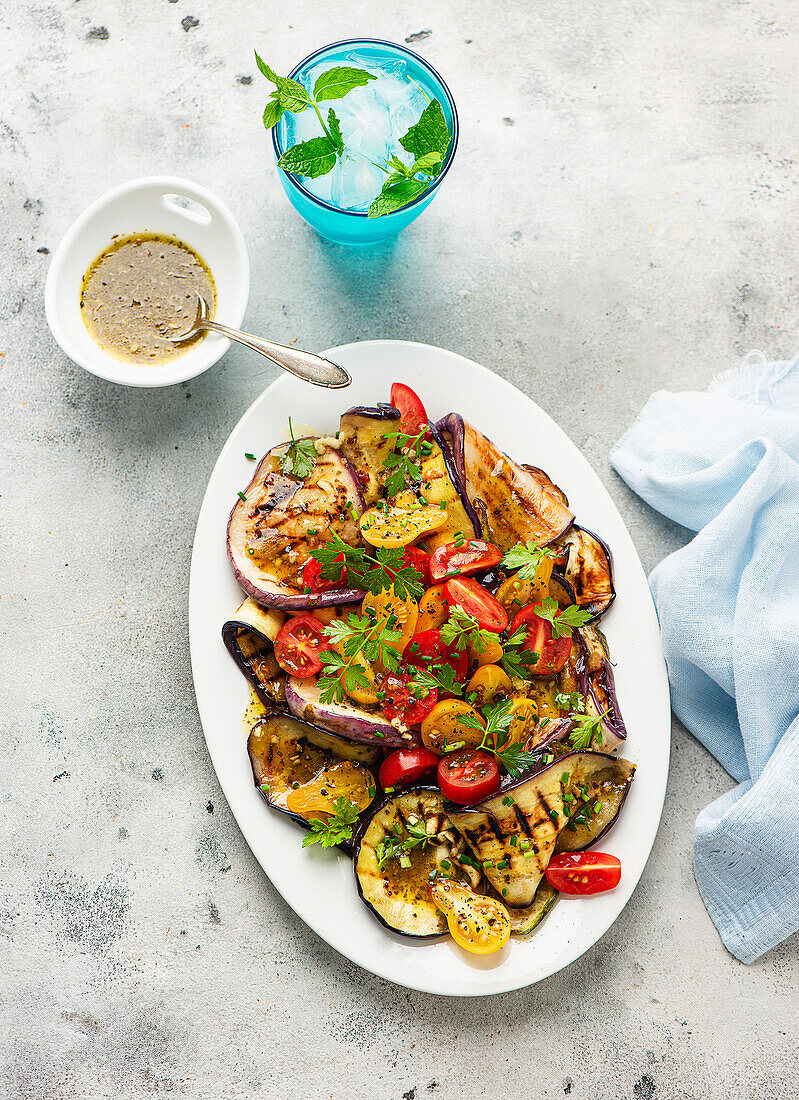 Grilled eggplant and tomato salad