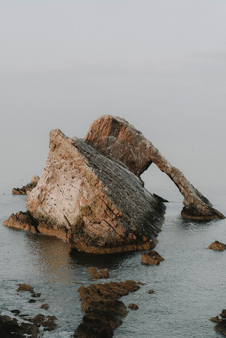 Majestic rock formation in sea, Portknockie, Aberdeenshire, Scotland\n