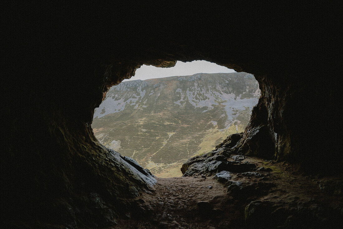 Rugged cave with mountain view, Assynt, Sutherland, Scotland\n