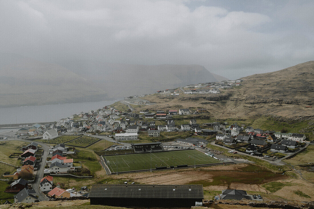 Village with soccer field, Eidi, Eysturoy, Faroe Islands\n