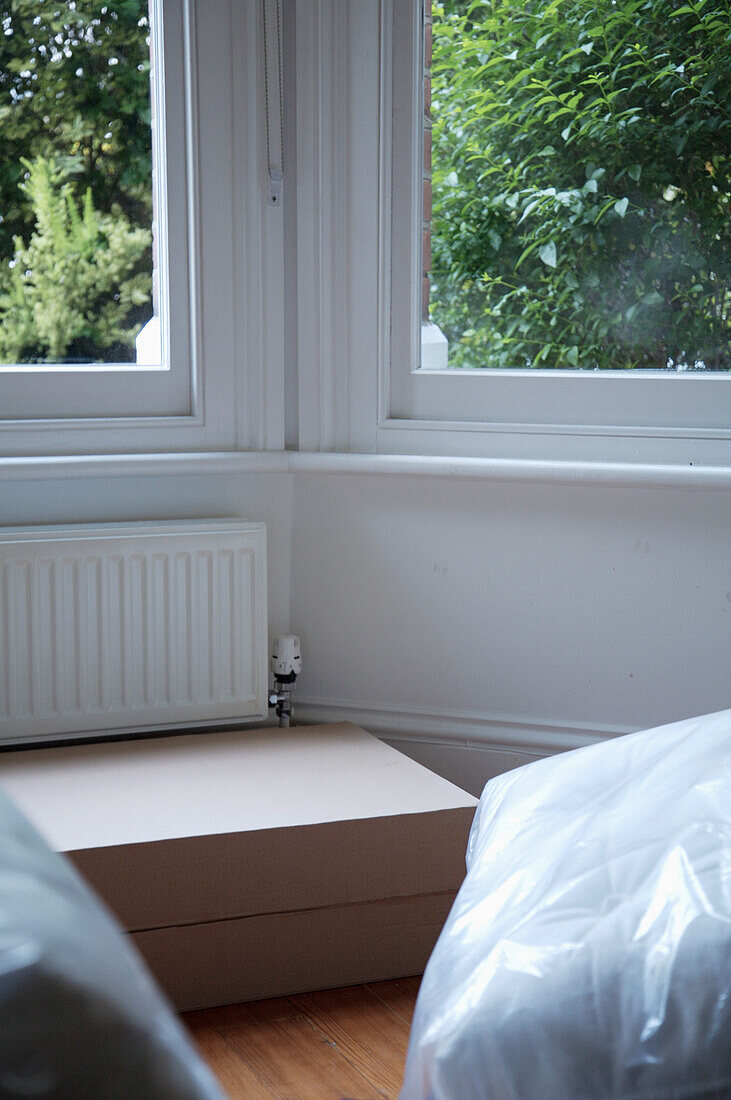 Close up of empty room with boxes and packages\n