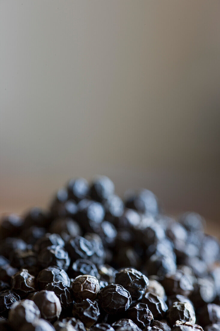 Close up of pile of black peppercorn\n