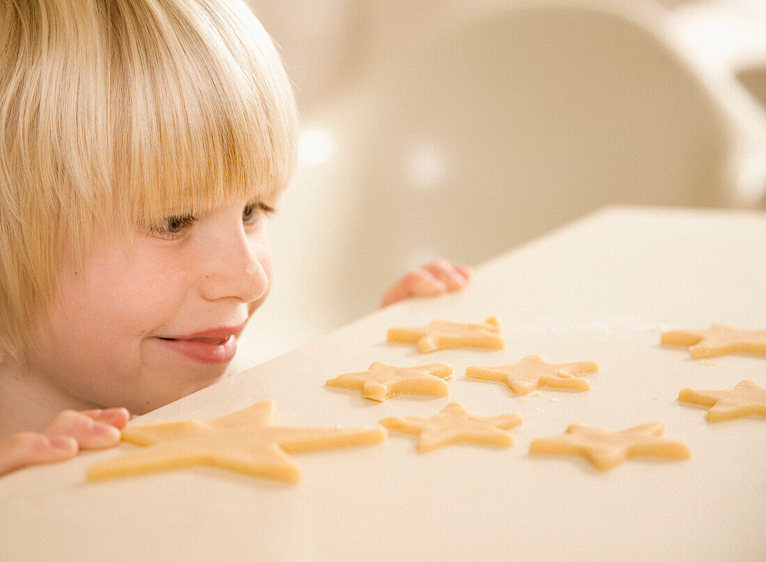 Young boy baking in kitchen\n