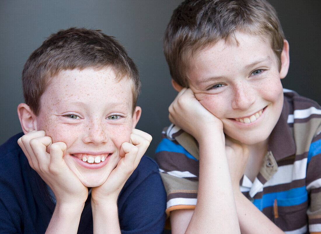 Portrait of two young boys smiling\n