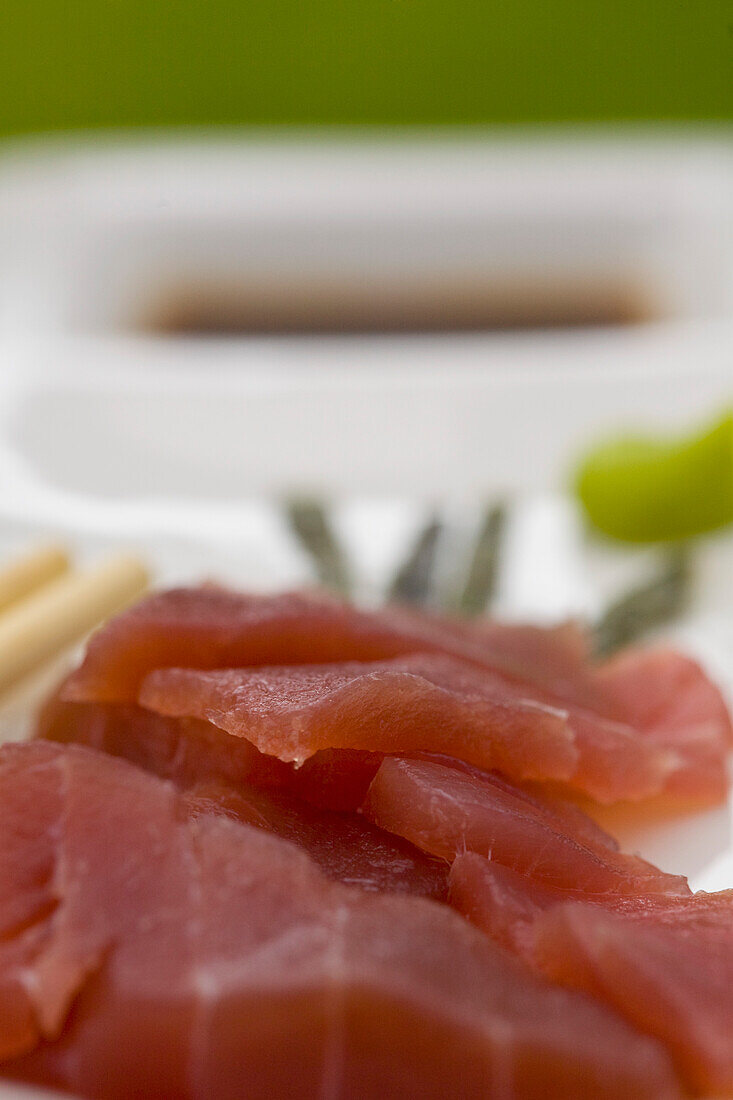 Plate of sushi with sliced tuna fish\n