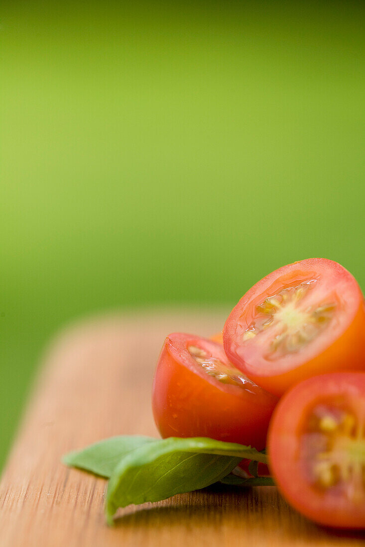 Cherry tomatoes and basil leaves\n