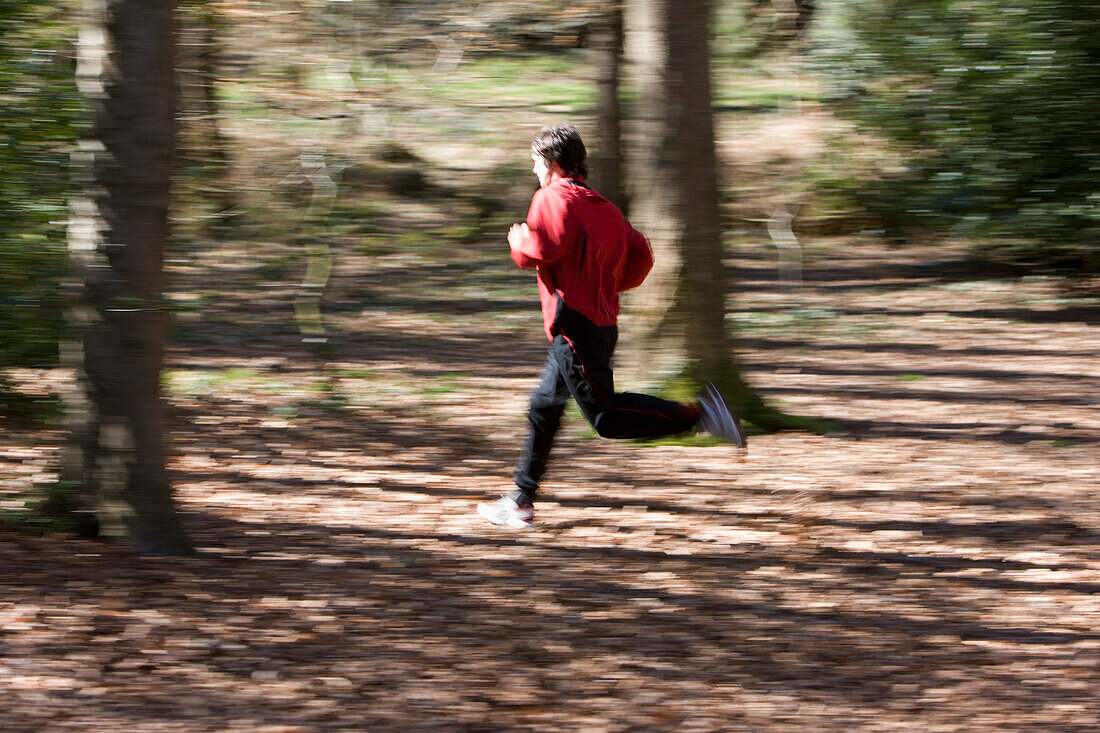 Portrait of a man running in the park\n