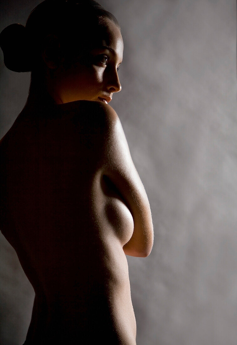 Profile of young beautiful nude woman\n