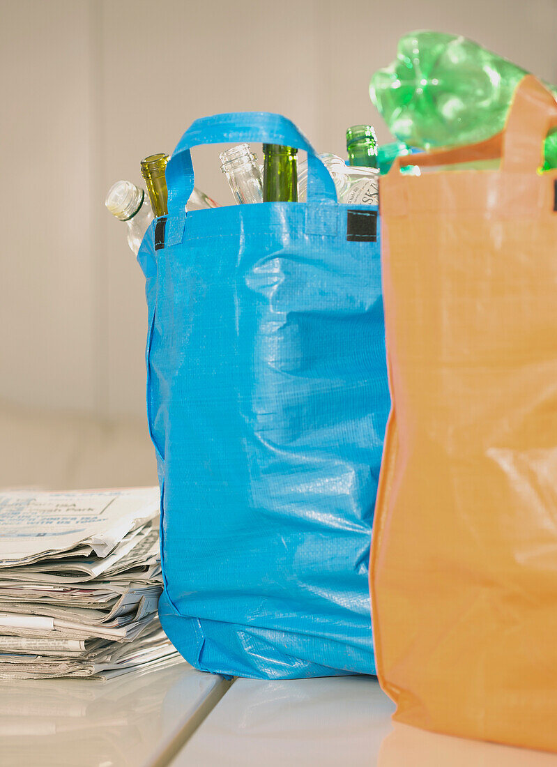 Close up of recycling bags full of garbage\n