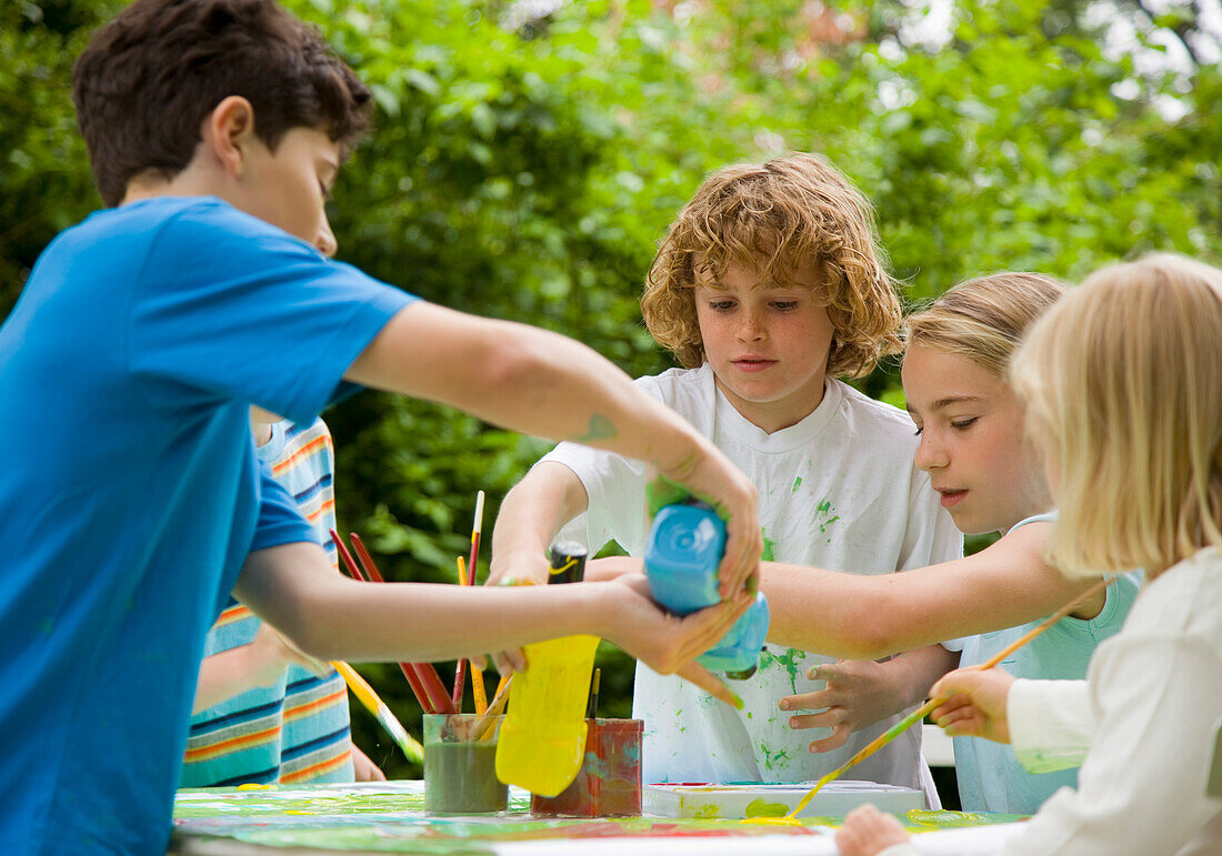 Children Painting in Garden\n