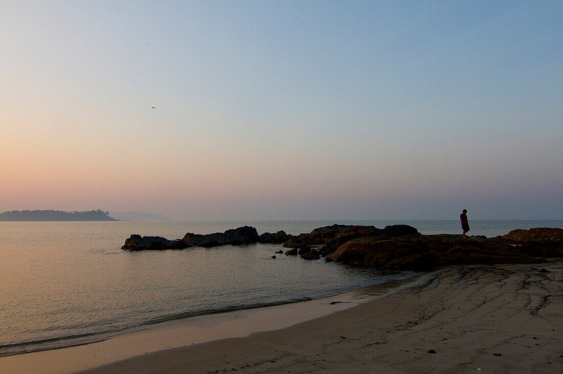 Beach scene at sunset, Goa, India\n