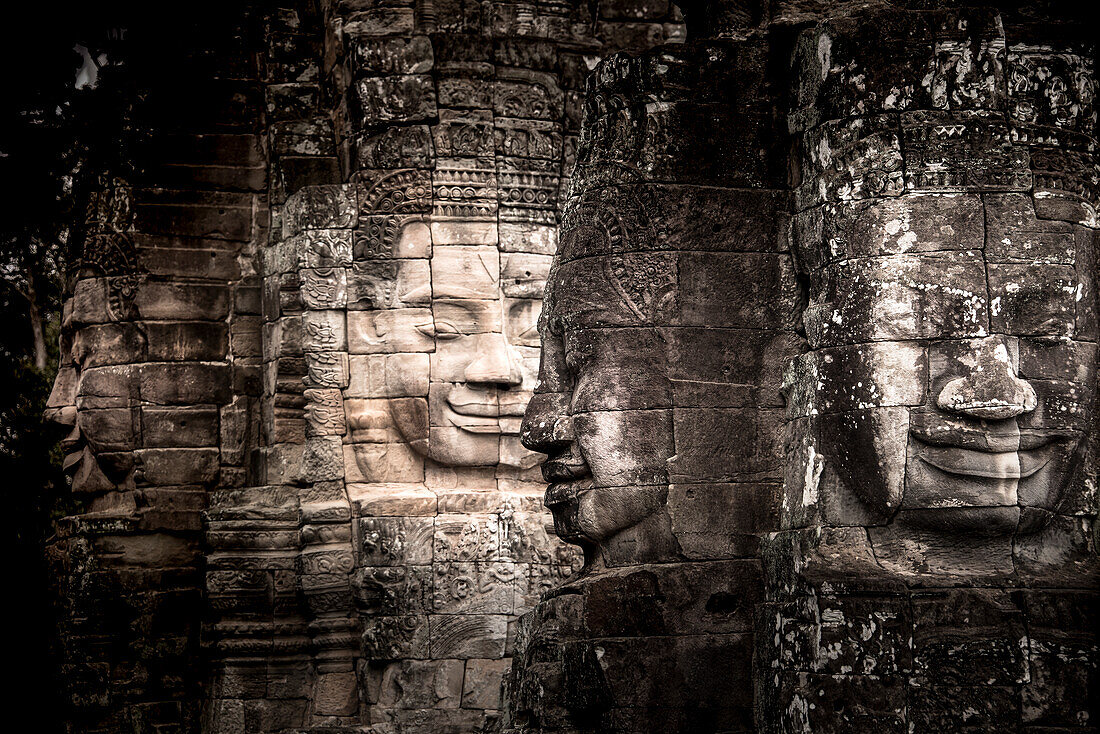 Ancient faces carved in stone at Bayon temple, Angkor Wat, UNESCO World Heritage Site, Cambodia, Indochina, Southeast Asia, Asia\n